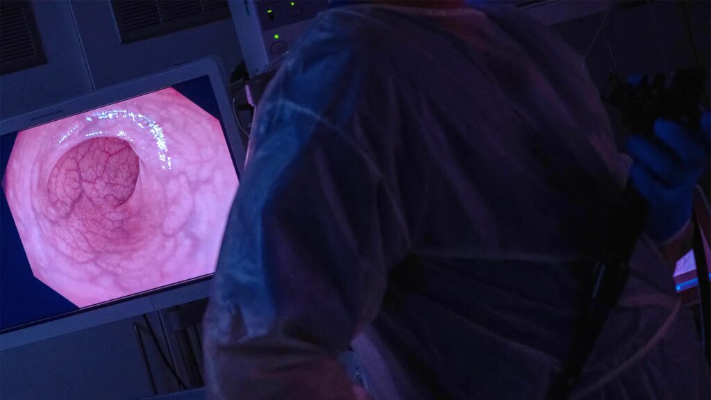 A photo of a gastroenterologist performing a colonoscopy.