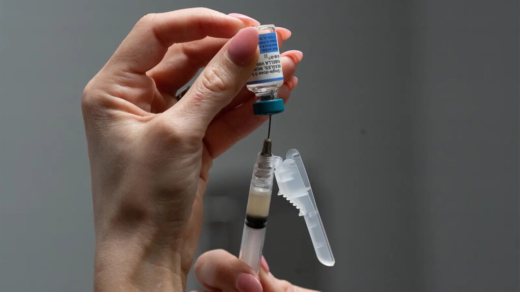 ACOG Makes Vaccine Recommendations for the First Time A photo of a nurse drawing MMR vaccine from a vial at Tiger Pediatrics in Easley, South Carolina.