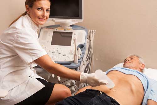 Radiologist prepping patient for abdominal ultrasound exam.