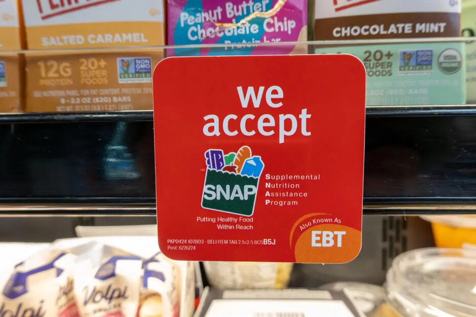 A photo of a Supplemental Nutrition Assistance Program advertisement on a shelf in a grocery store.