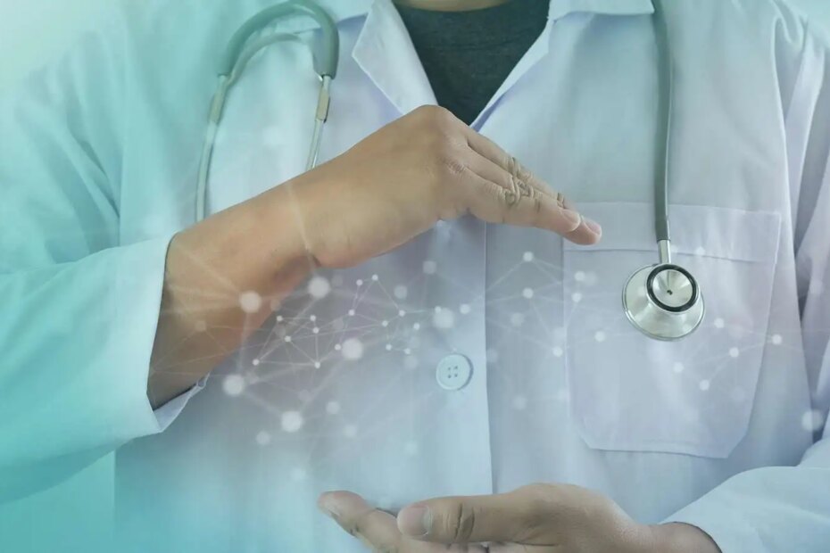 Doctor with technology concept between his hands.