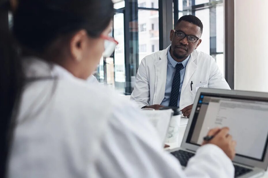 A photo of physicians meeting in a hospital.