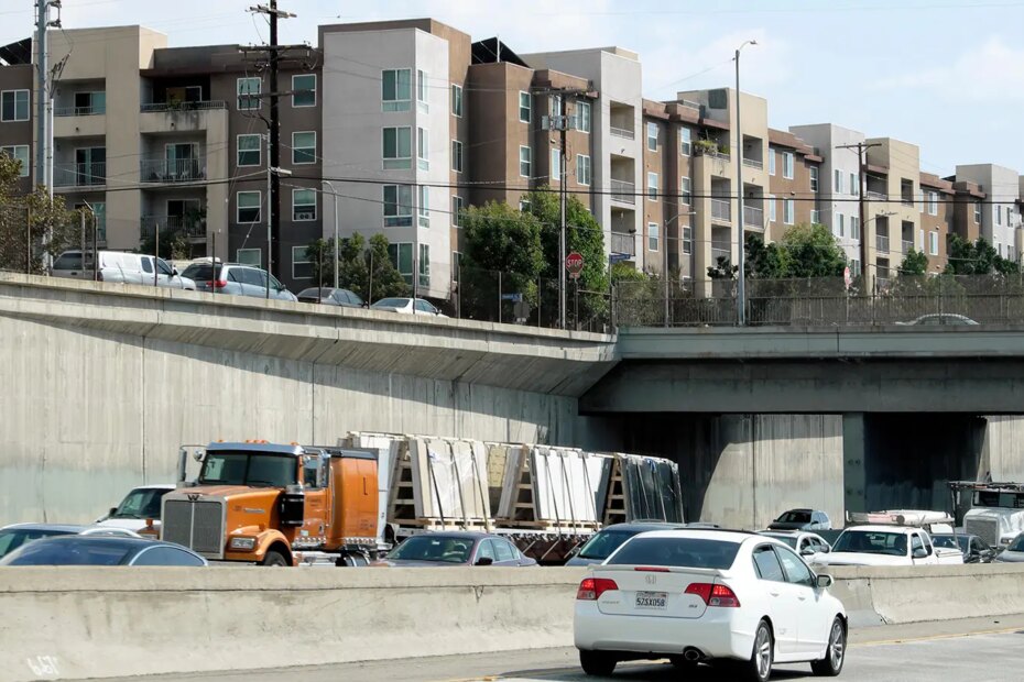A photo of apartment buildings above a highway in Los Angeles, California.