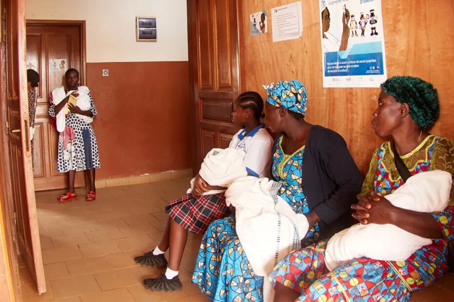 A photo of mothers with their babies at the Soa District Hospital for the malaria vaccination rollout in Yaounde, Cameroon.