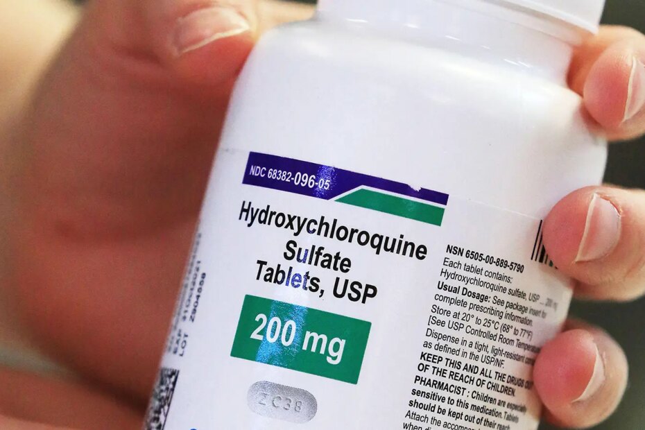A photo of a woman holding a bottle of hydroxychloroquine tablets.