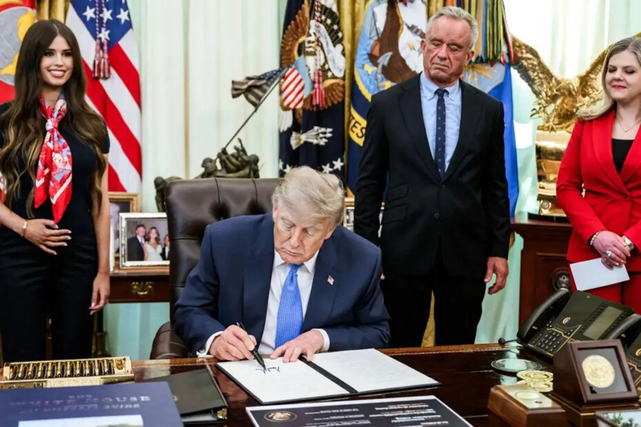 A photo of Trump signing an executive order on vaccines.